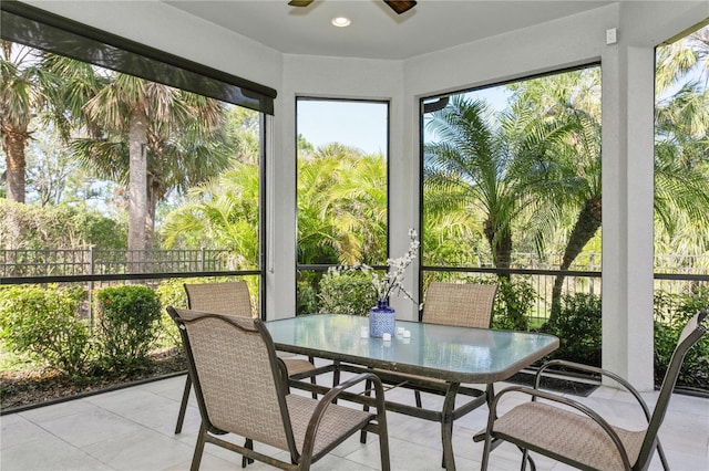 sunroom featuring ceiling fan