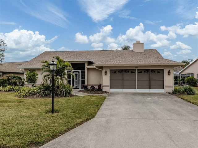 ranch-style home featuring a front yard and a garage