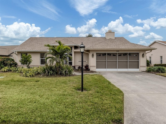 single story home with a front yard and a garage