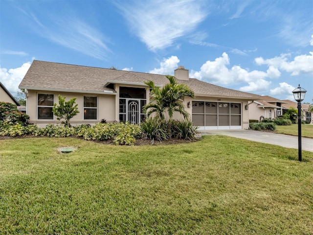 single story home featuring a front yard and a garage