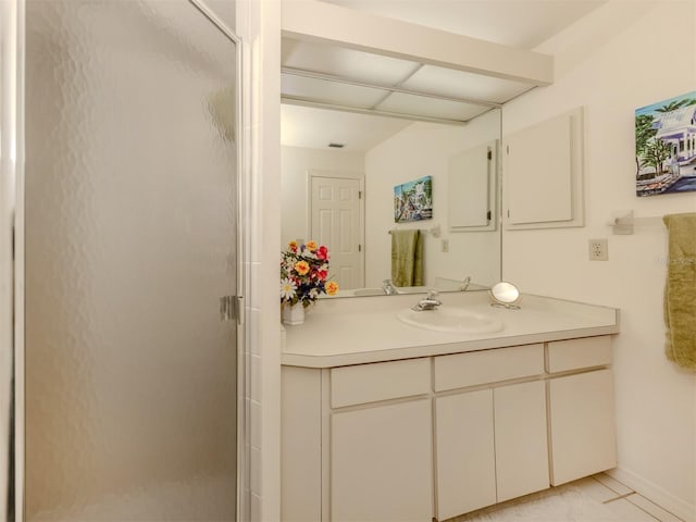 bathroom featuring vanity, tile patterned flooring, and an enclosed shower