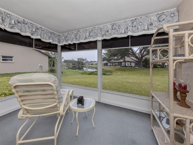 sunroom with a healthy amount of sunlight and a water view