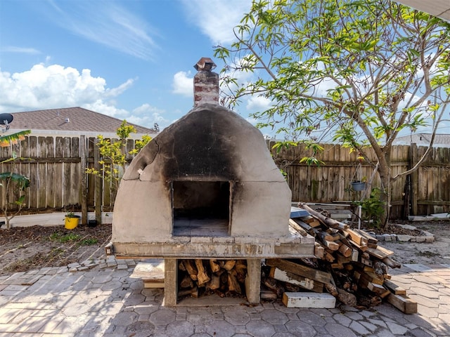 view of patio / terrace featuring an outdoor fireplace