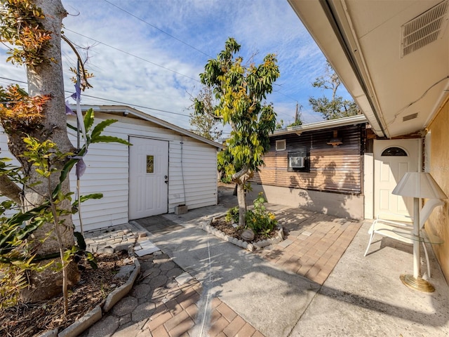 view of patio / terrace featuring a storage shed