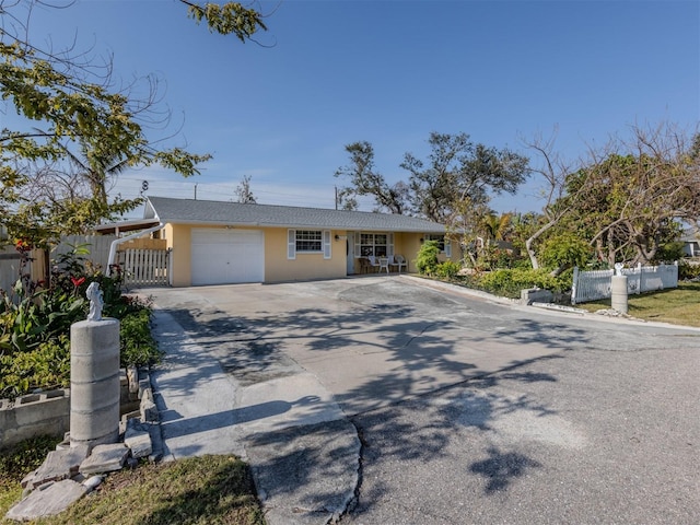 single story home featuring a garage