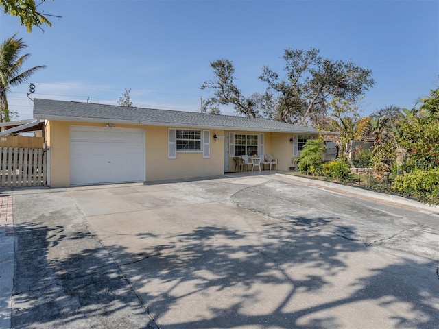 ranch-style home featuring a garage