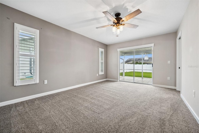 empty room with carpet flooring and ceiling fan