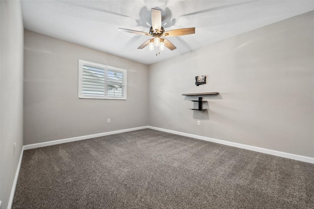 spare room featuring carpet and ceiling fan