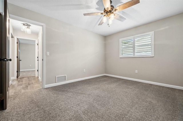 unfurnished room featuring carpet flooring and ceiling fan