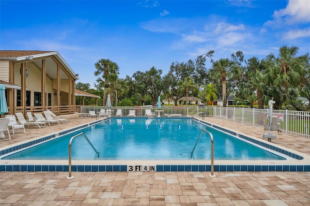 view of swimming pool featuring a patio area