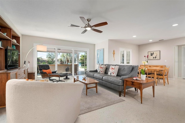 living room with ceiling fan