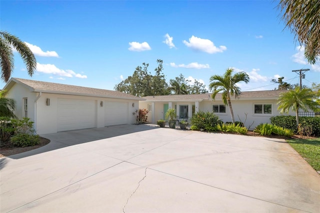 ranch-style house featuring a garage