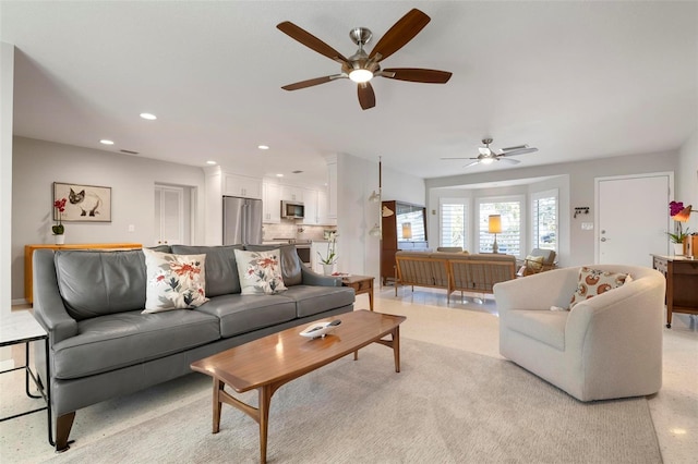 living room featuring ceiling fan