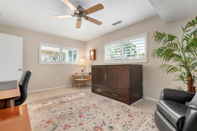 home office with ceiling fan and light tile patterned flooring