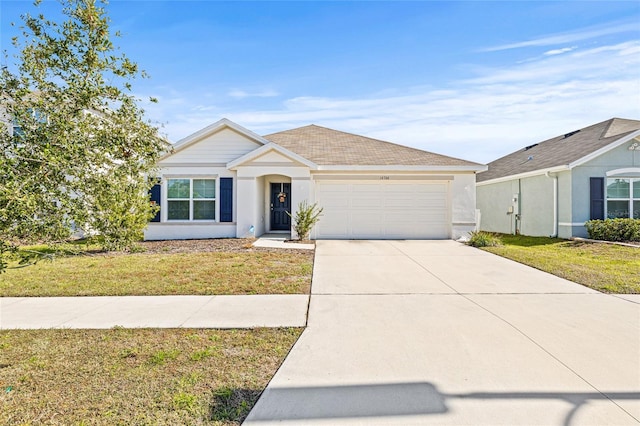 16766 Carlton Pond St, Wimauma, FL 33598 - ranch-style house with a front yard and a garage