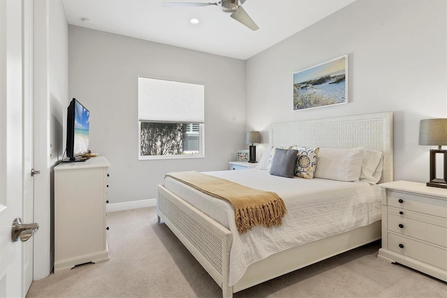 bedroom with light colored carpet and ceiling fan