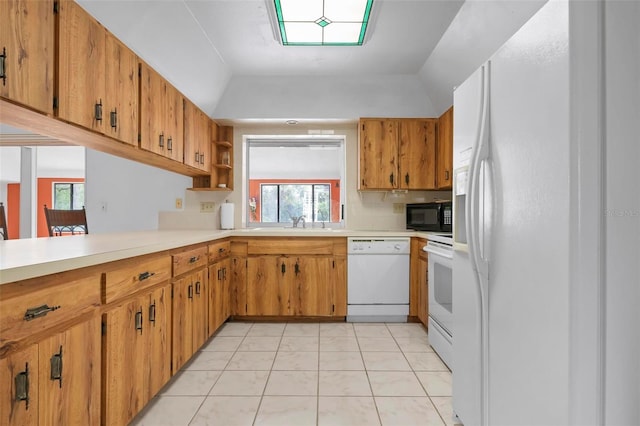 kitchen featuring sink, lofted ceiling, white appliances, decorative backsplash, and light tile patterned flooring