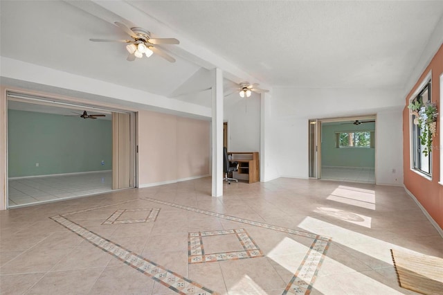 unfurnished living room featuring light tile patterned floors and vaulted ceiling with beams