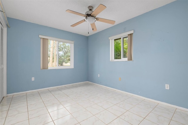 spare room featuring ceiling fan