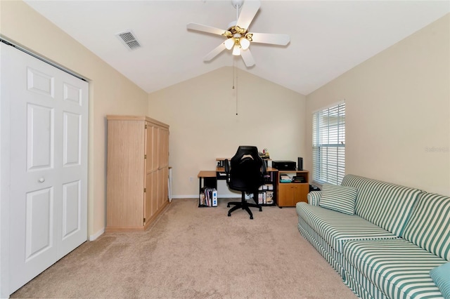 carpeted office space with ceiling fan and lofted ceiling