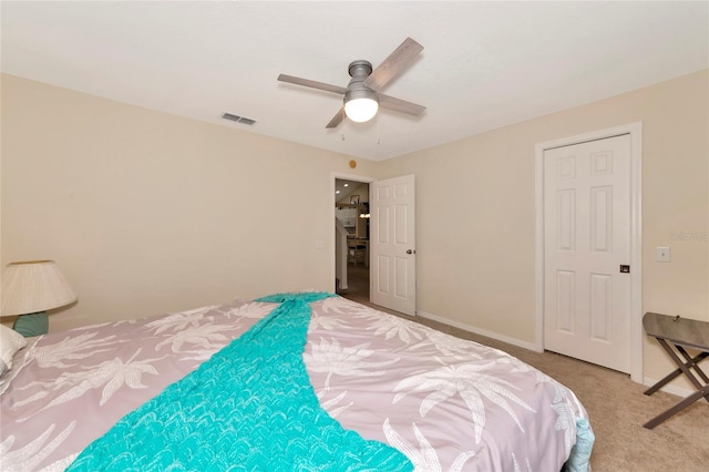 bedroom with ceiling fan and light colored carpet