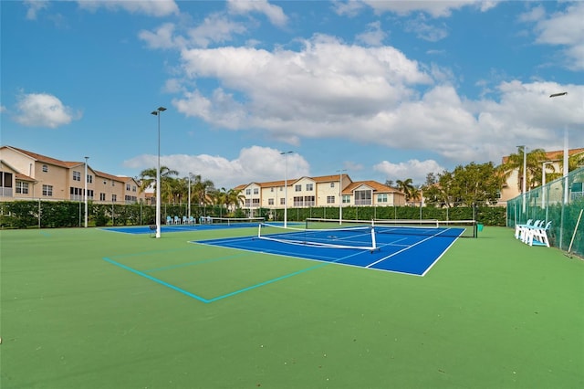 view of sport court with basketball hoop