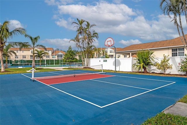 view of sport court featuring tennis court