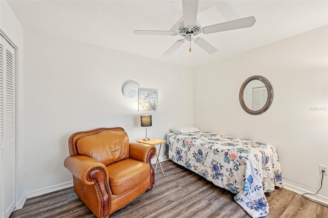 bedroom featuring ceiling fan, wood-type flooring, and a closet