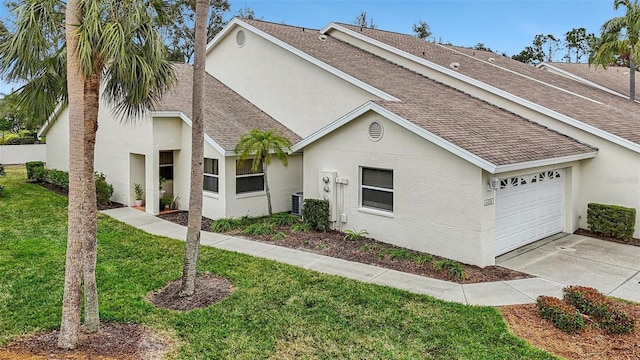 view of front of property with central AC unit and a front yard