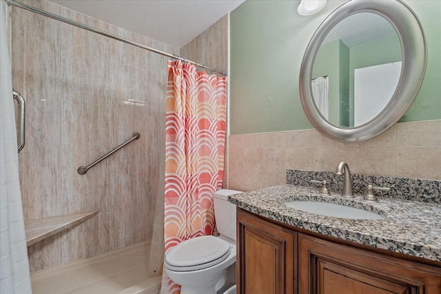 bathroom featuring toilet, vanity, and curtained shower