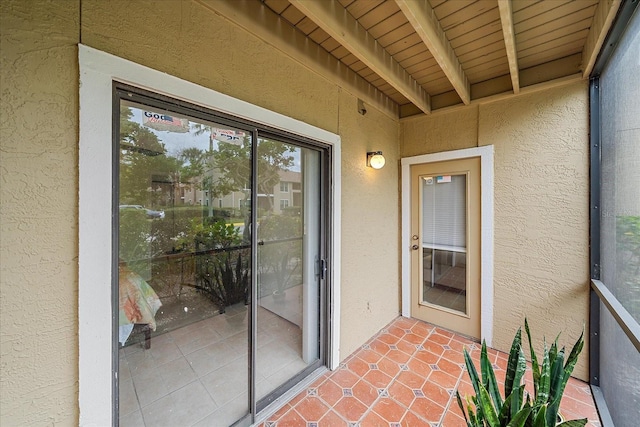 entrance to property featuring a patio area