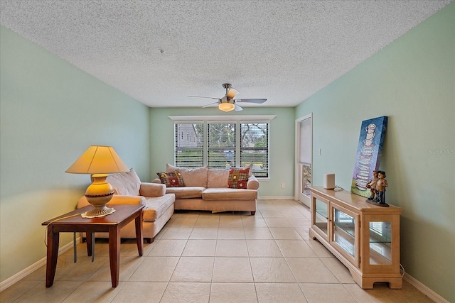 living room featuring ceiling fan and light tile patterned floors