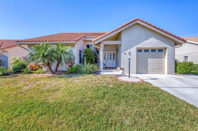 view of front of home with a garage and a front yard