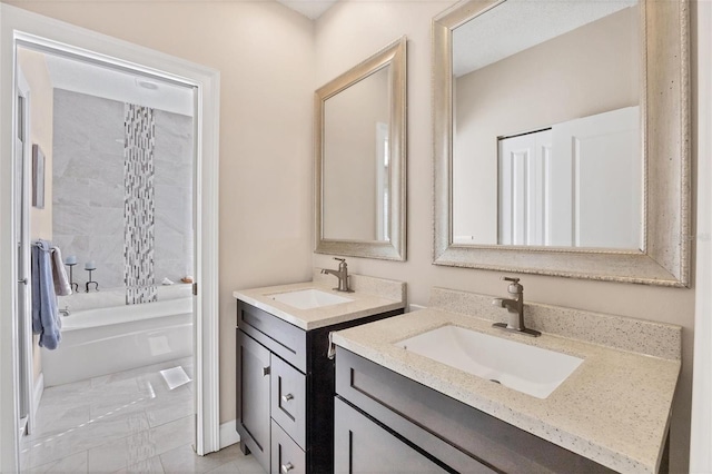 bathroom with vanity and a bathing tub