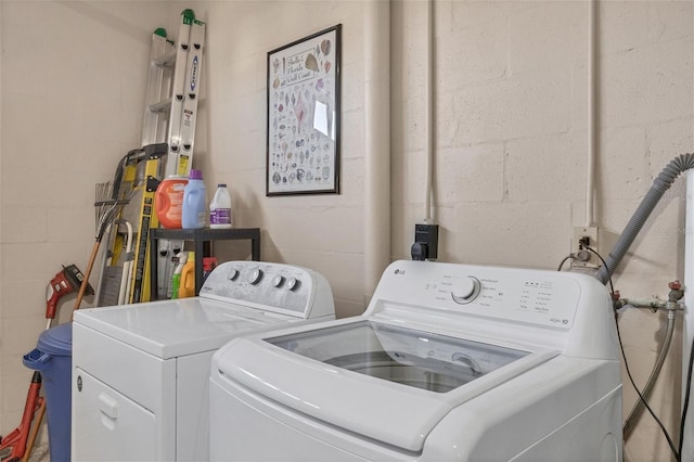 clothes washing area featuring washing machine and clothes dryer