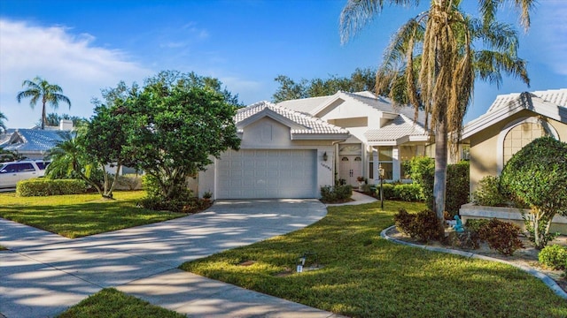 view of front facade featuring a front yard and a garage