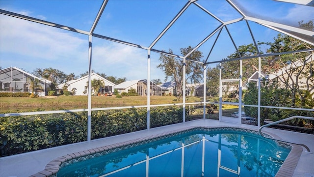 view of pool with a lanai