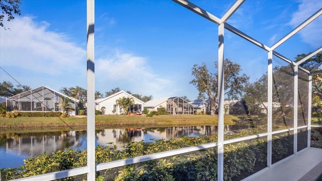 unfurnished sunroom with a water view