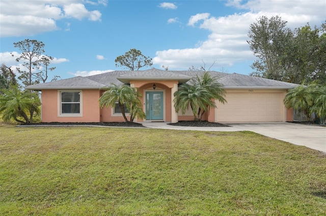 view of front of property featuring a garage and a front lawn