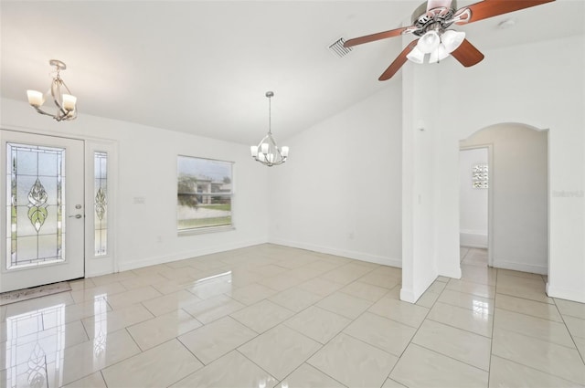 foyer with light tile patterned flooring, lofted ceiling, and ceiling fan with notable chandelier