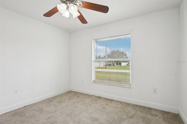 carpeted empty room with ceiling fan