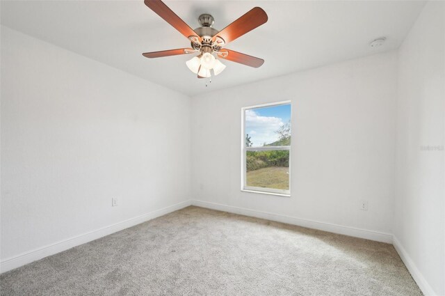 unfurnished room with carpet and ceiling fan