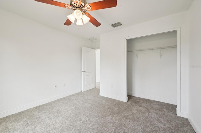 unfurnished bedroom with light carpet, ceiling fan, and a closet