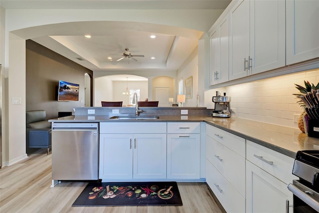 kitchen with sink, kitchen peninsula, and dishwasher