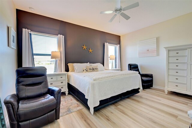 bedroom featuring ceiling fan and light hardwood / wood-style floors