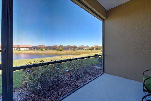 balcony featuring a water view