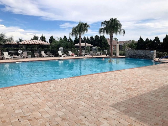 view of pool featuring a patio