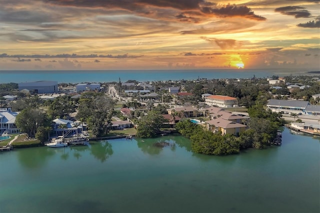 aerial view at dusk with a water view