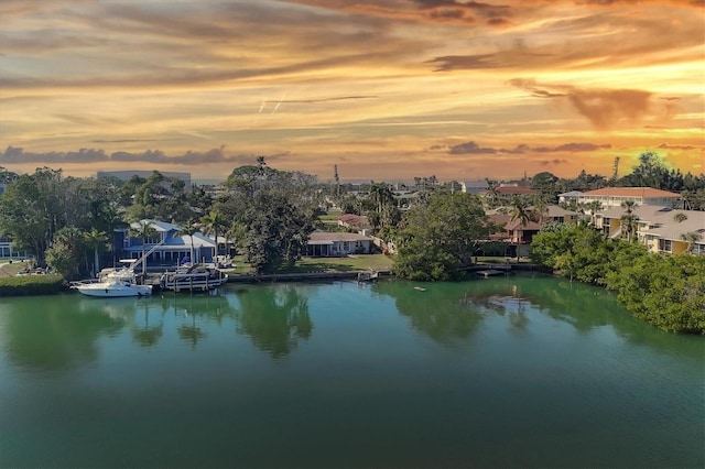 aerial view at dusk with a water view