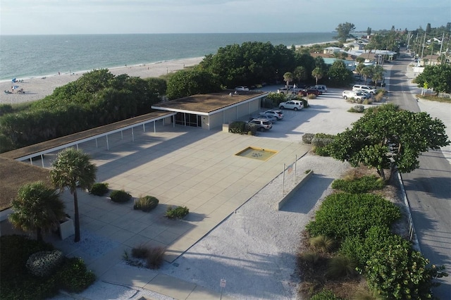 aerial view featuring a view of the beach and a water view